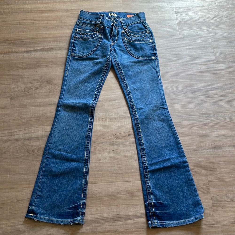 Tag jeans with studs around pockets. Size 25. Great condition